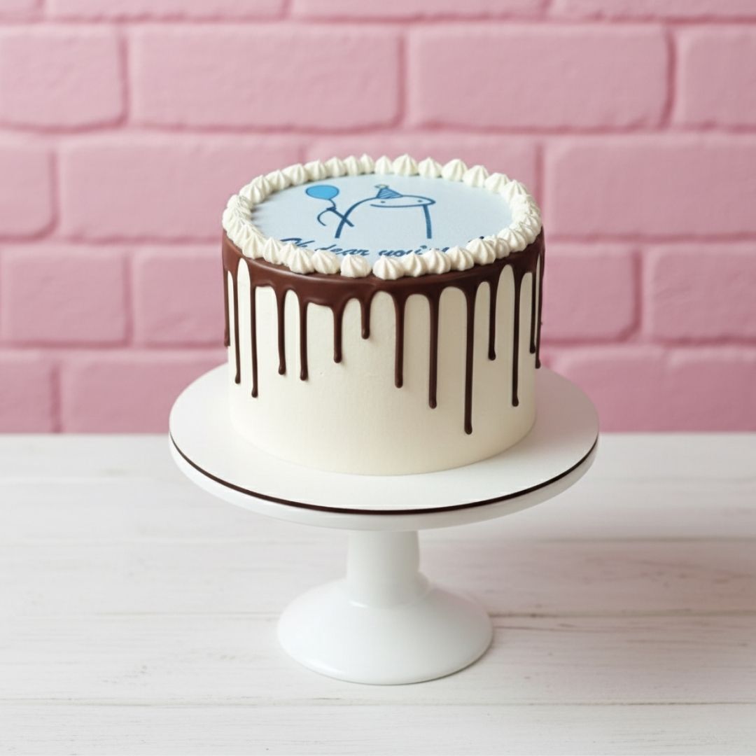 Drip cake on a white stand with a pink brick wall background