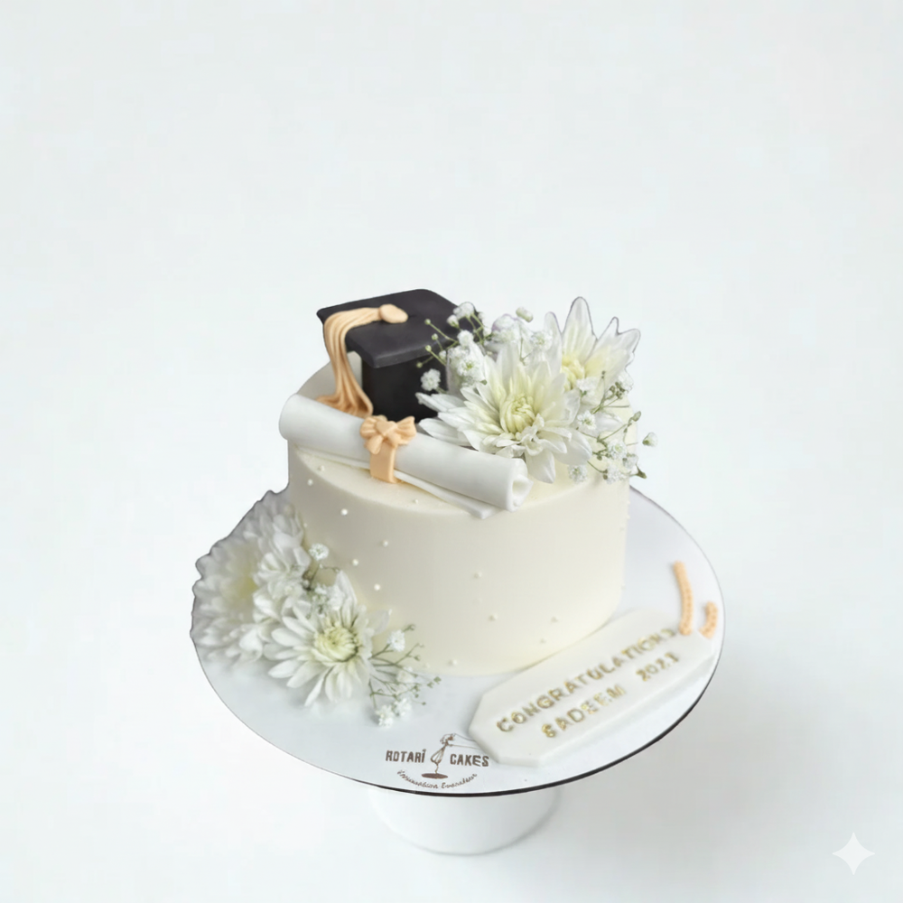 
                  
                    Graduation-themed cake with flowers on a white background
                  
                