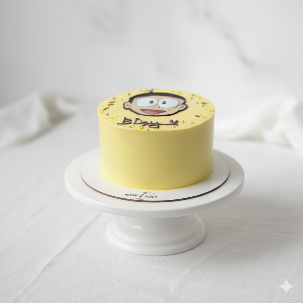 
                  
                    Yellow cake with a cartoon character on a white stand against a light background
                  
                