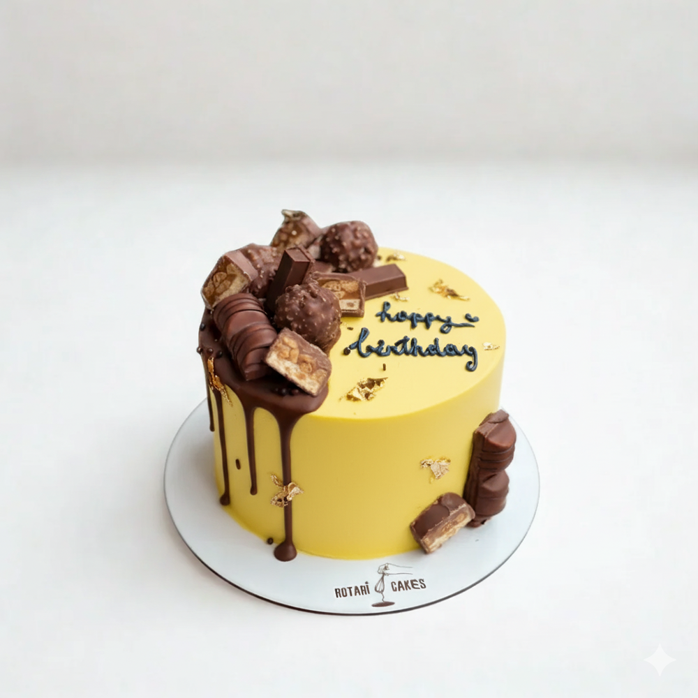 
                  
                    Yellow birthday cake with chocolate decorations on a white background
                  
                